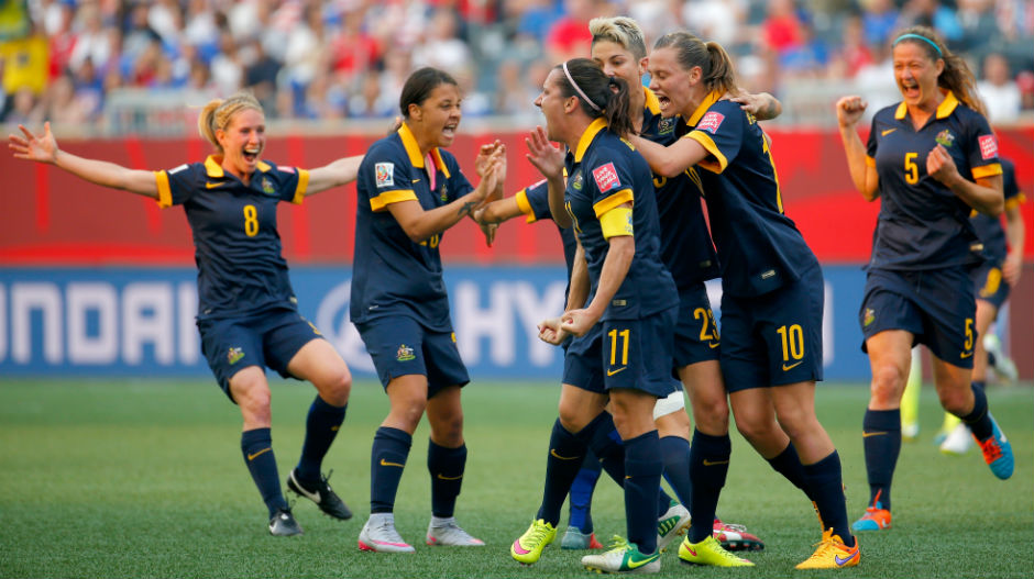 The Matildas celebrate after deservedly drawing level, the sides going into the break locked at 1-1.