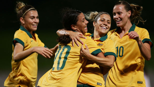 Sam Kerr celebrates with her Matildas teammates.