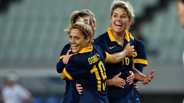 Michelle Heyman and Katrina Gorry celebrate a goal during the Matildas' Olympic qualifiers.