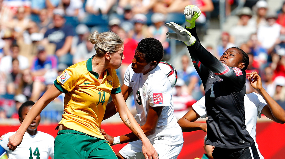 Alanna Kennedy competes for a header in the first half against Nigeria.