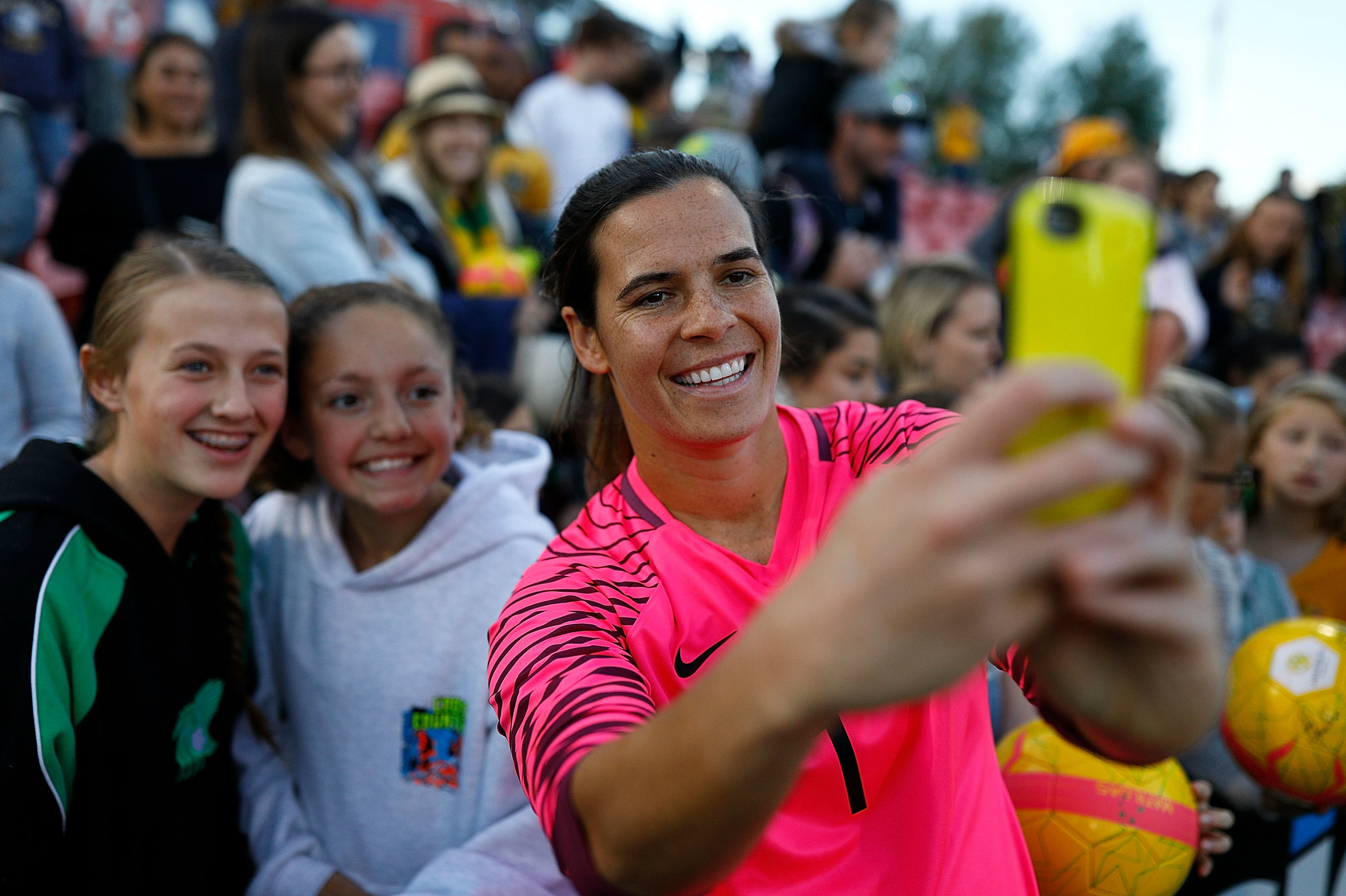 Westfield Matildas goalkeeper Lydia Williams takes a selfie with some fans.