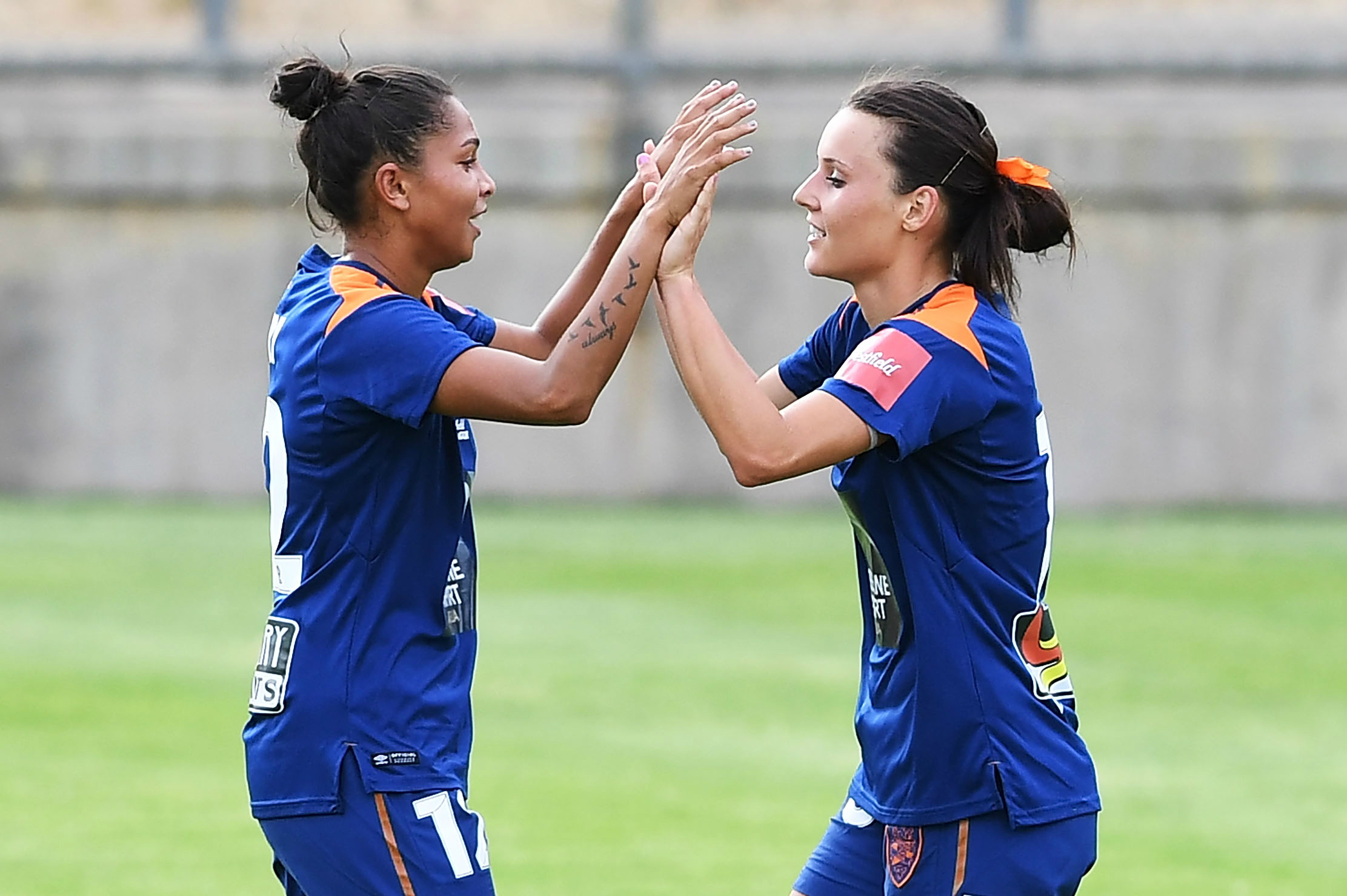 Hayley Raso (right) is congratulated by Allira Toby after her goal against Adelaide.