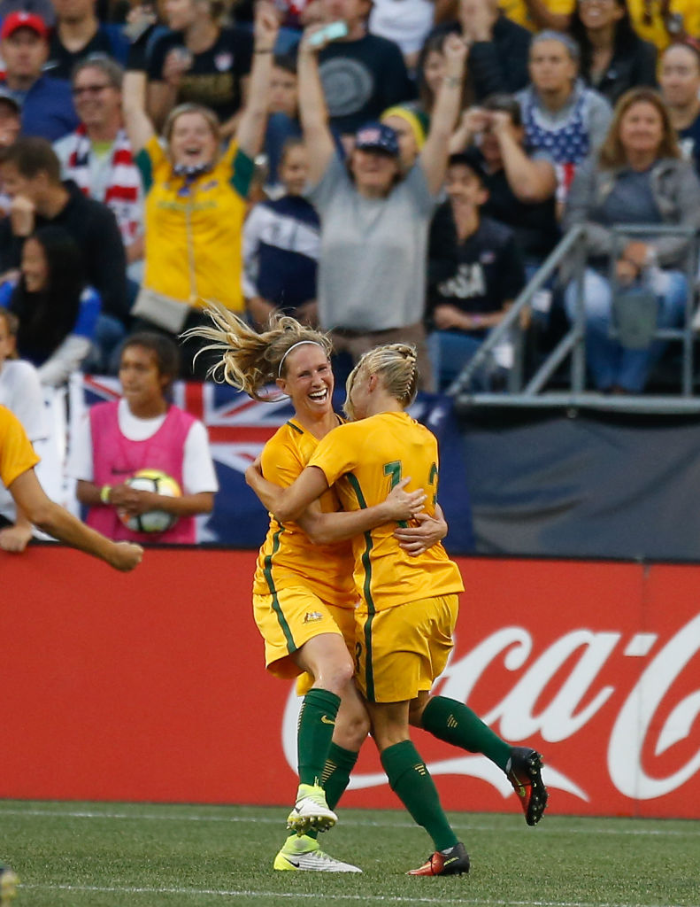 Tameka Butt and Elise Kellond-Knight celebrate the goal against the United States
