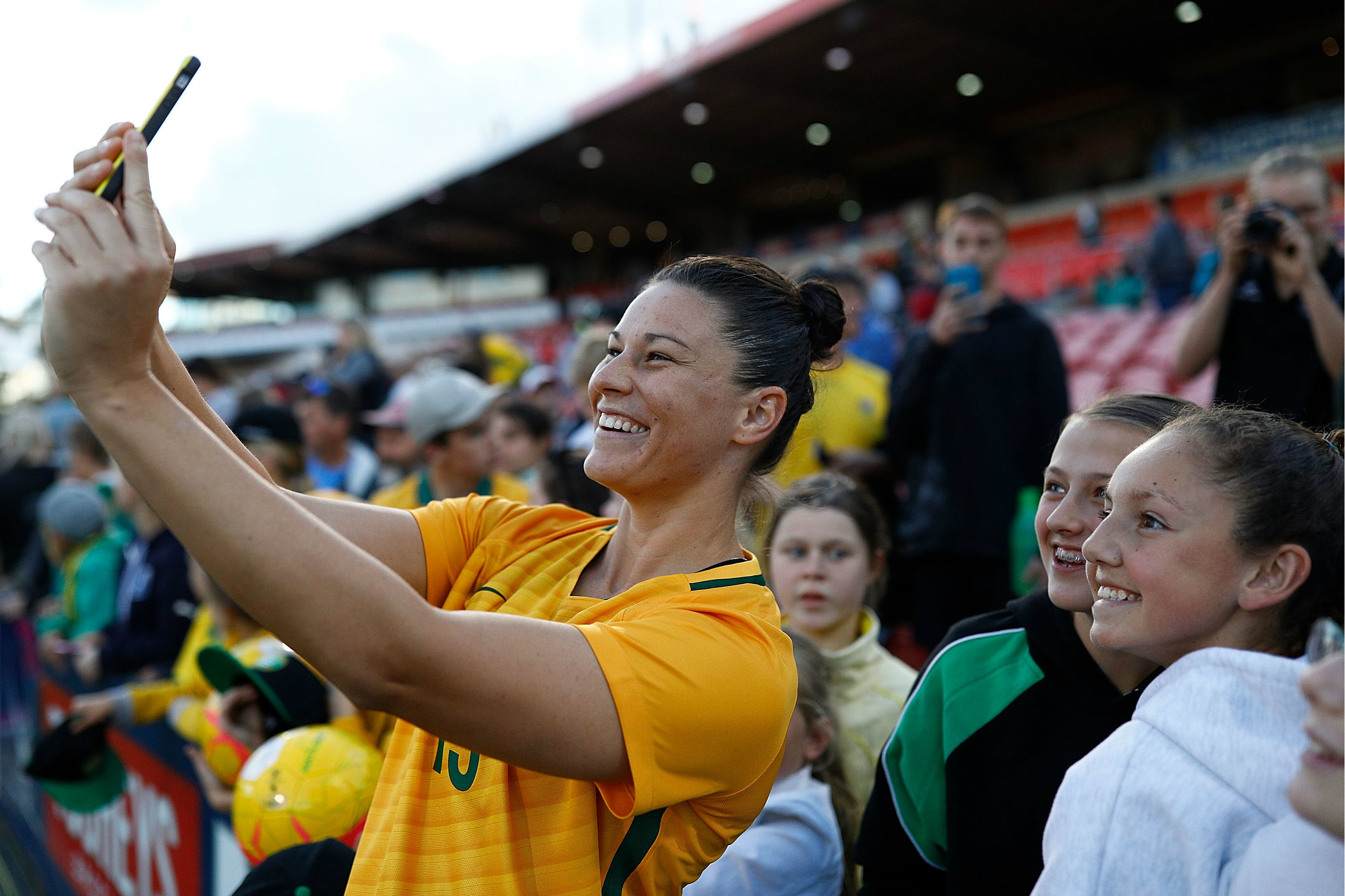 Emily Gielnik takes a selfie with some Westfield Matildas fans.