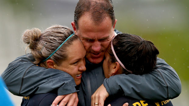 Westfield Matildas coach Alen Stajcic embraces Kyah Simon and Lisa De Vanna after Australia beat Brazil at the Women's World Cup.
