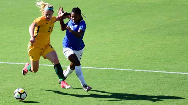 Ellie Carpenter holds off a Brazilian attacker during Australia's 6-1 win at the Tournament of Nations.