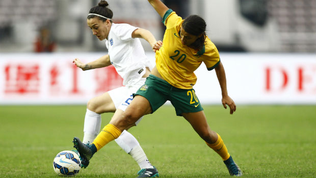 Sam Kerr tries to win the ball from England's Lucy Bronze.